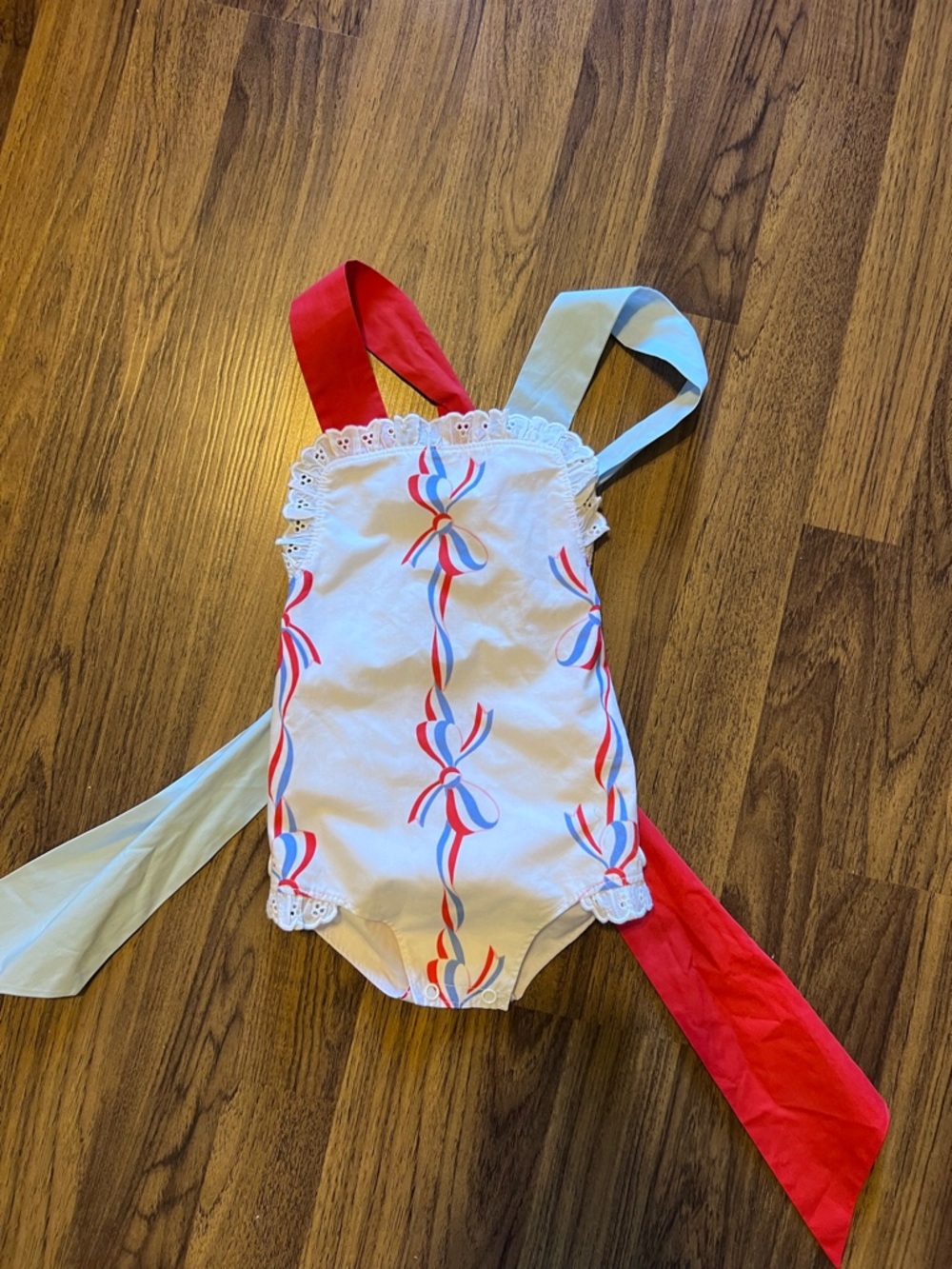 The Beaufort Bonnet Company White Sunsuit with Red & Light Blue Ties